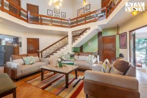 Sun N Sky by StayVista - Poolside villa with chic interiors, lawn & gazebo