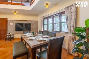 Sun N Sky by StayVista - Poolside villa with chic interiors, lawn & gazebo