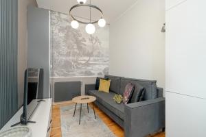 Stylish Grey Apartments with a City View in Poznań by Renters