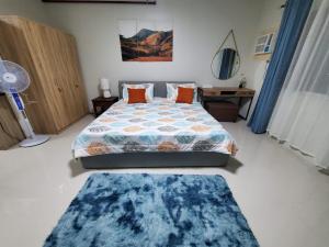 Stay at VERDANT by Camella Manors Deluxe King Bed with Balcony, Swimming Pool & Gym