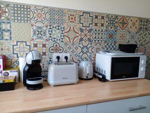 Appartements Studio 33 m2 , climatise, parking exterieur prive gratuit : photos des chambres