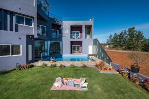 SaffronStays Blueberry - 4BR Panchgani villa with pool, bar lounge & terrace, lush garden vibes for family celebrations