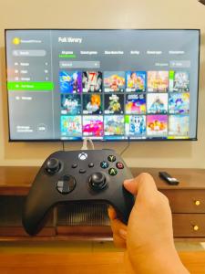 1 Queen Bed & 2 double beds at One Uptown Residences with XBOX and Netflix