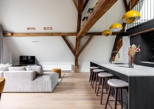City-view loft with wooden beams and mezzanine