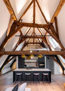 City-view loft with wooden beams and mezzanine