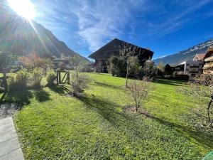 Romantic Swiss Alp Iseltwald with Lake & Mountains