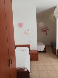 Camera Familiare con Vista Giardino