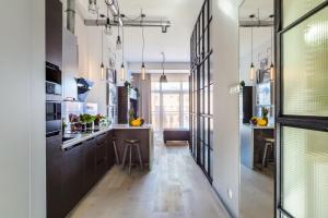 Lumina Loft Tymienieckiego with a view of the lake