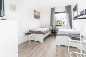 MR Living I moderne Apartments mit Einzelbetten, voll ausgestattete Küche, WLAN, Parkplatz, ideal für Monteure I DR01, DR02