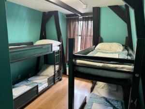Bed in 4-Bed Mixed Dormitory Room room in Amsterdam Hostel Uptown