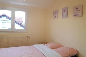 Appartements F3 avec salle de jeux, terrasse et grand jardin : photos des chambres