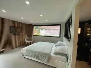 Appartements Chalet moderne & Jacuzzi privatif a proximite de Gerardmer : photos des chambres