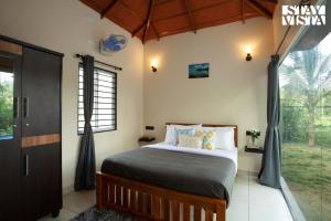 StayVista at Palm Tree Homes with Complimentary Breakfast, BBQ Grill and Pet-Friendly Home