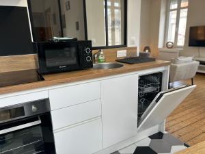Appartements Le petit Universel : photos des chambres