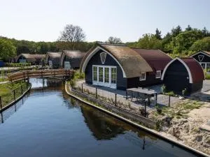 Modern house on a pond in a wooded area - Tuk
