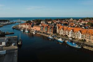 Apartamenty Bałtyckie - Grand Baltic - WIFI, Klimatyzacja, Sala Zabaw, Taras wypoczynkowy, centrum Ustki