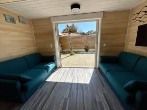 Maisons de vacances Chaleureuse maisonnette avec piscine partagee : photos des chambres