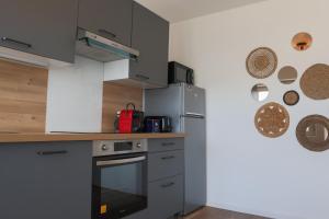 Appartements L-Escale cosy, proche Euroairport : photos des chambres