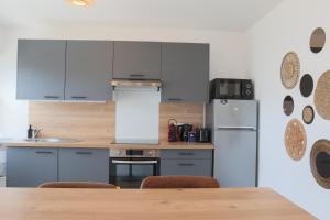 Appartements L-Escale cosy, proche Euroairport : photos des chambres