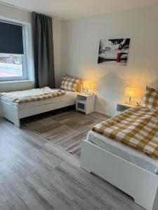 Strandallee Ferienwohnungen