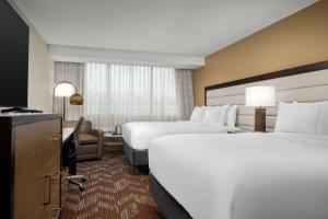 Queen Room with Two Queen Beds and Roll-In Shower - Mobility Accessible room in Holiday Inn Greensboro Airport an IHG Hotel