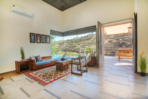 SaffronStays Moringa WishingTree - 3-BR villa near Nathdwara with pool, lawn and hillside views