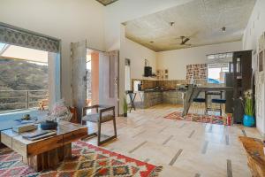 SaffronStays Moringa WishingTree - 3-BR villa near Nathdwara with pool, lawn and hillside views