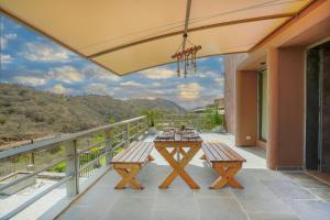 SaffronStays Moringa WishingTree - 3-BR villa near Nathdwara with pool, lawn and hillside views