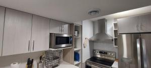 Cozy 2-Bedroom Basement Guest Suite with Private Entrance and Proximity to the Airport
