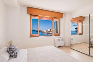 Una Finestra Su Cala Rossa by Wonderful Italy