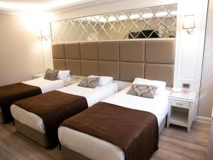 Deluxe Triple Room room in Fimka Hotel