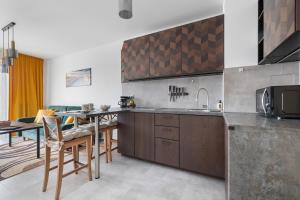 Unique Apartment KAMPAT with Balcony for 4 Guests by Noclegi Renters