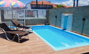 Mar Doce Lar Casa na praia de guaratuba com piscina e ar condicionado