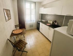 Appartements Au pied des Remparts 10 rue Saint jean : photos des chambres