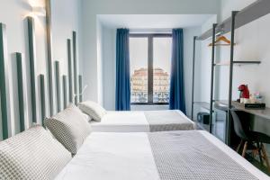Basic Triple Room room in Hostal Carmen & Coworking