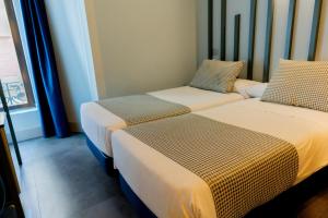 Twin Room with Private Bathroom room in Hostal Carmen & Coworking