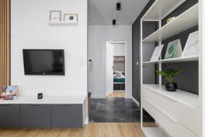 Black and Grey Apartment in Cracow with Balcony, Parking and Desk by Renters