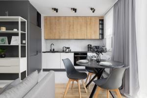 Black and Grey Apartment in Cracow with Balcony, Parking and Desk by Renters