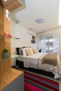 Praia dos Ingleses à 100mt do mar, com varanda e churrasqueira