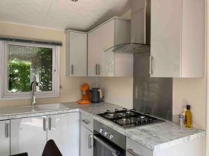 Luxury spacious house with two bathrooms at park with swimming pools, restaurant, bowling, massage & wellness