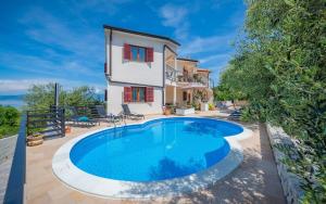 Apartments with a swimming pool Drenje, Labin - 22999