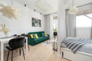 Modern White Studio with Furnished Balcony in Wrocław by Renters