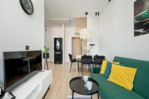 Modern White Studio with Furnished Balcony in Wrocław by Renters