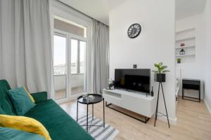 Modern White Studio with Furnished Balcony in Wrocław by Renters