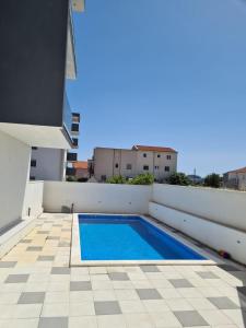 Sunny day , three bedroom apartment with pool