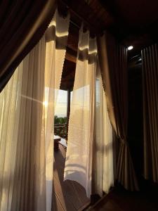 The wooden house has a beautiful sunrise & seaview