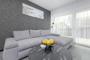 Black and Grey Ground Floor Apartment Close to the Beach by Renters