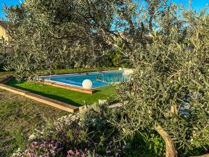 Appartements Le Petit Valexiane Piscine & Jardin : photos des chambres
