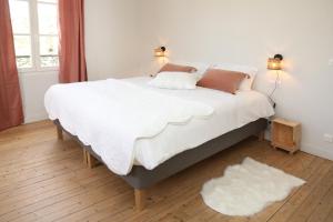 Appartements La Maison du Clocher by La Boite En Plus : photos des chambres