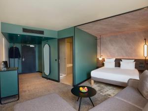 Junior Suite with One Queen Bed and Sofa room in Novotel Bern Expo